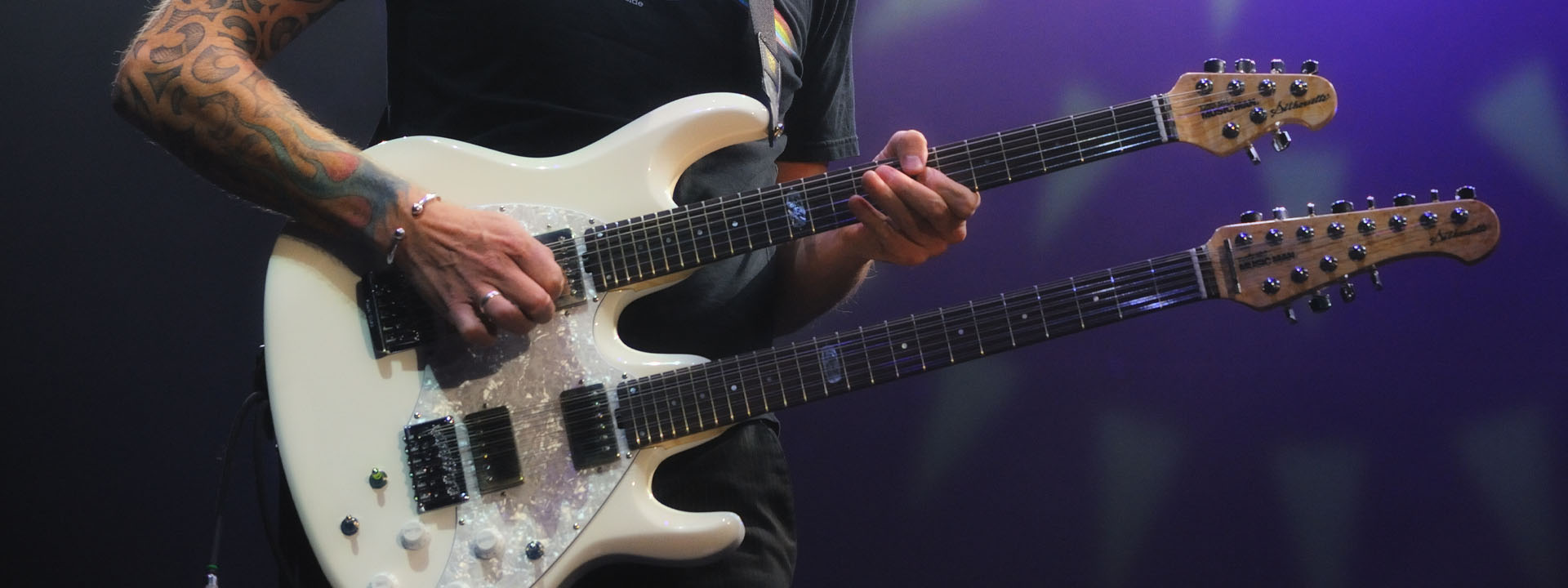 Guitarist playing double neck guitar